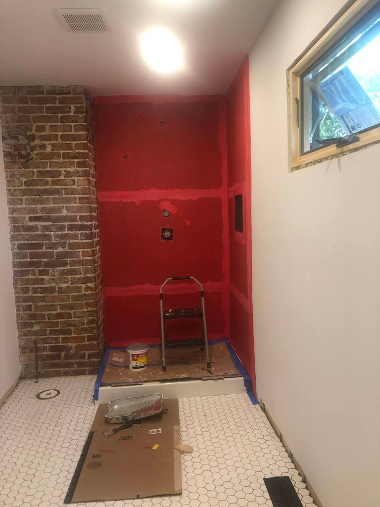Red Guard waterproofing membrane on the shower walls